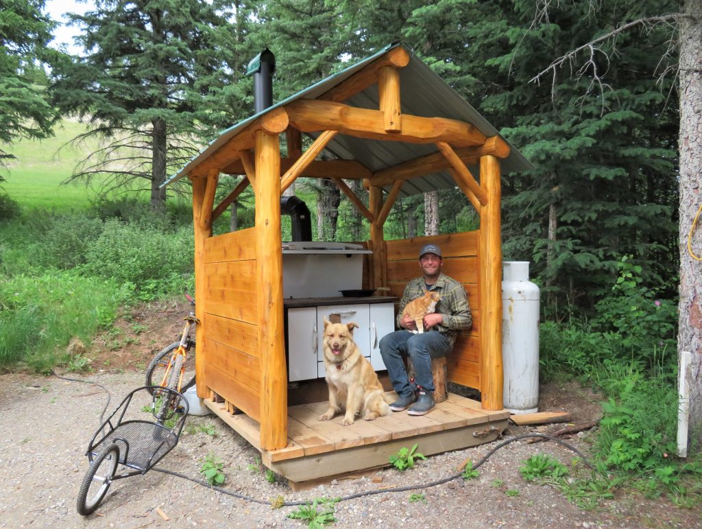 Small cabin living with a cook shelter, Carl, cat and dog