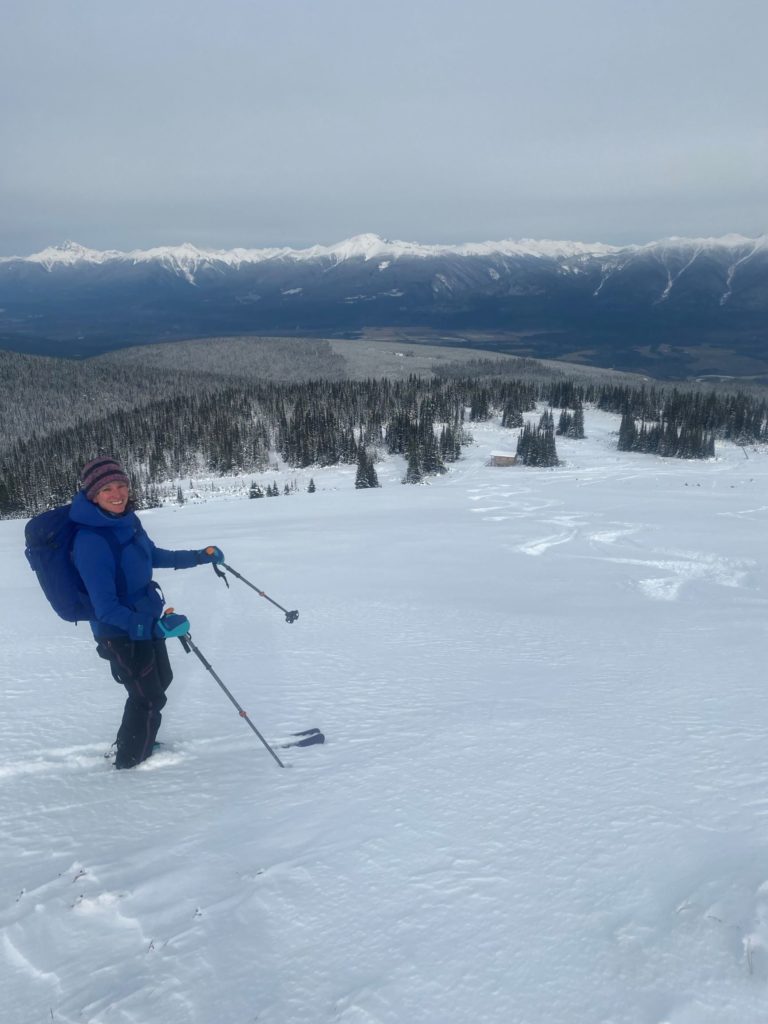 Backcountry Skiing on mountain looking down during shoulder season